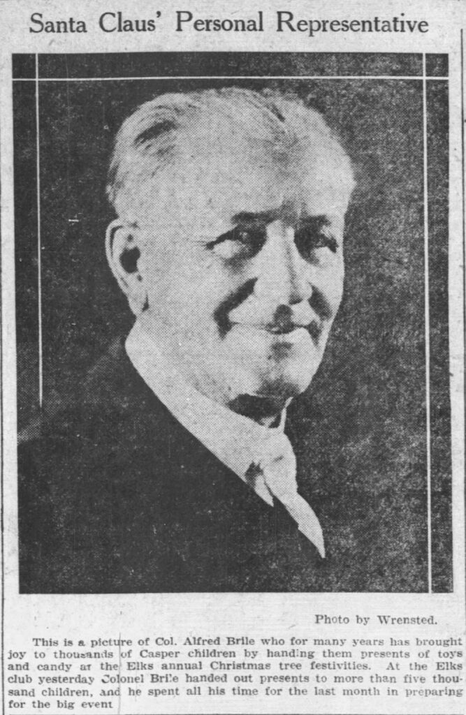 Photo by the Wrensted Studio of Colonel Alfred Briile, dubbed "Santa's Personal Representative" in the headline. Colonel Brile has handed out candy at toys to oveer 5000 children over the years at the annual Elks Club holiday parties. Colonel Brile spends more than a month gettting ready each year for the event. Casper Star Tribune, December 26, 1924 