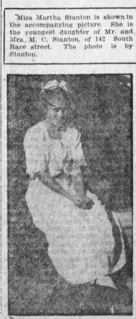 Photo of the teenage Martha Stanon, sitting with her hands primly folded on her lap. Springfield News, October 25, 1914