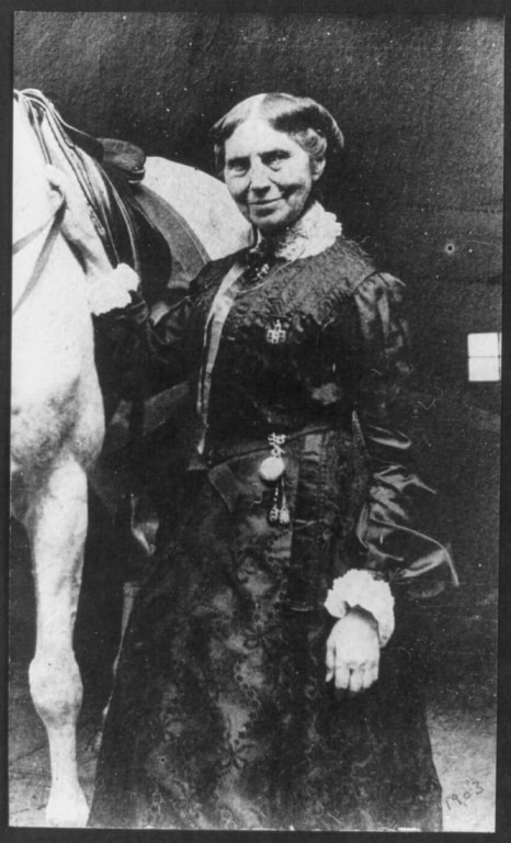 1903 Clara Barton and a horse; photo by Clara Barton Drew. (Courtesy Library of Congress)