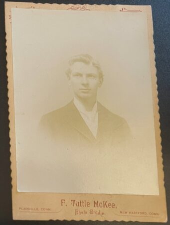 Photo of a young main in a jacket and white tie, F. Tutle McKee, studios in Plainville, Connecticut and New Hartford, Connecticut