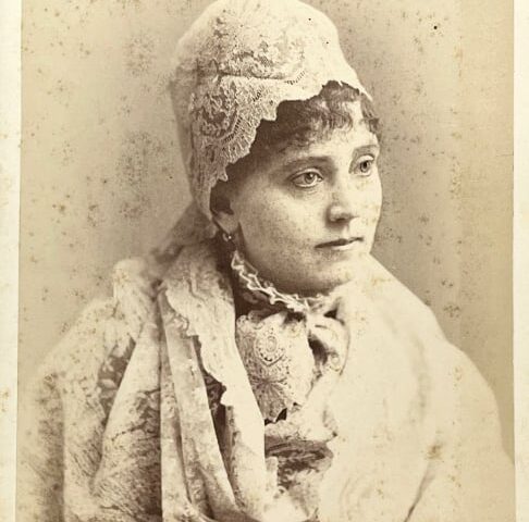 Front of cabinet card by Lydia J. Cadwell showing woman draped in a lace shawl and headpiece. (Courtesy McIntyre-Culy Collection)